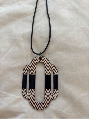 Hermes: Geometric Chevron Pendant Necklace in Brown & Black